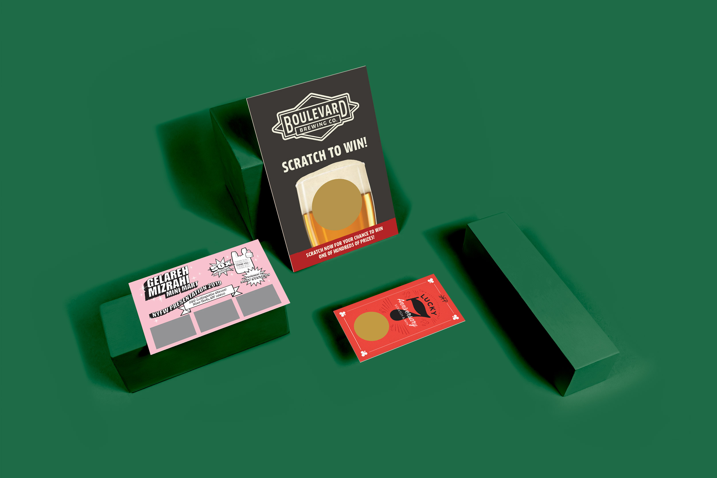 Custom classic scratch off cards: Boulevard Brewing, Gelareh Mizrahi, and Lucky Anniversary designs on green blocks