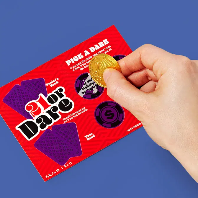 21 or Dare red scratch-off card with a gold coin held over a chip icon